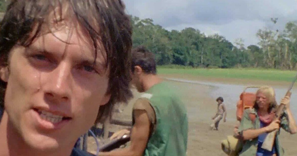 Film crew member in Cannibal Holocaust stares at the camera