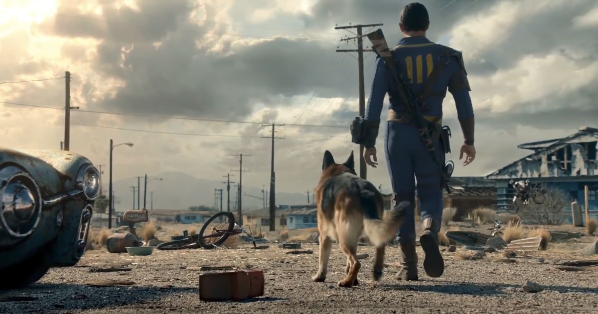 Dogmeat following the Lone Wanderer across the post-apocalyptic zone in Fallout 4.