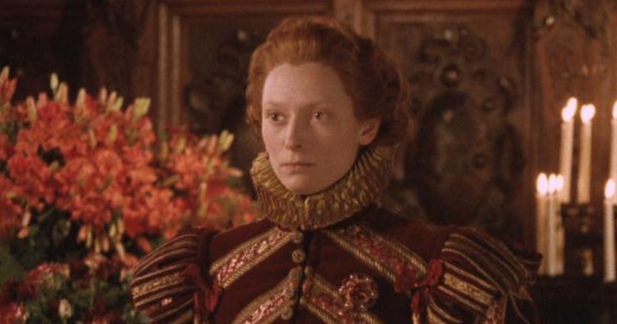 Person stands in Elizabethan male attire.