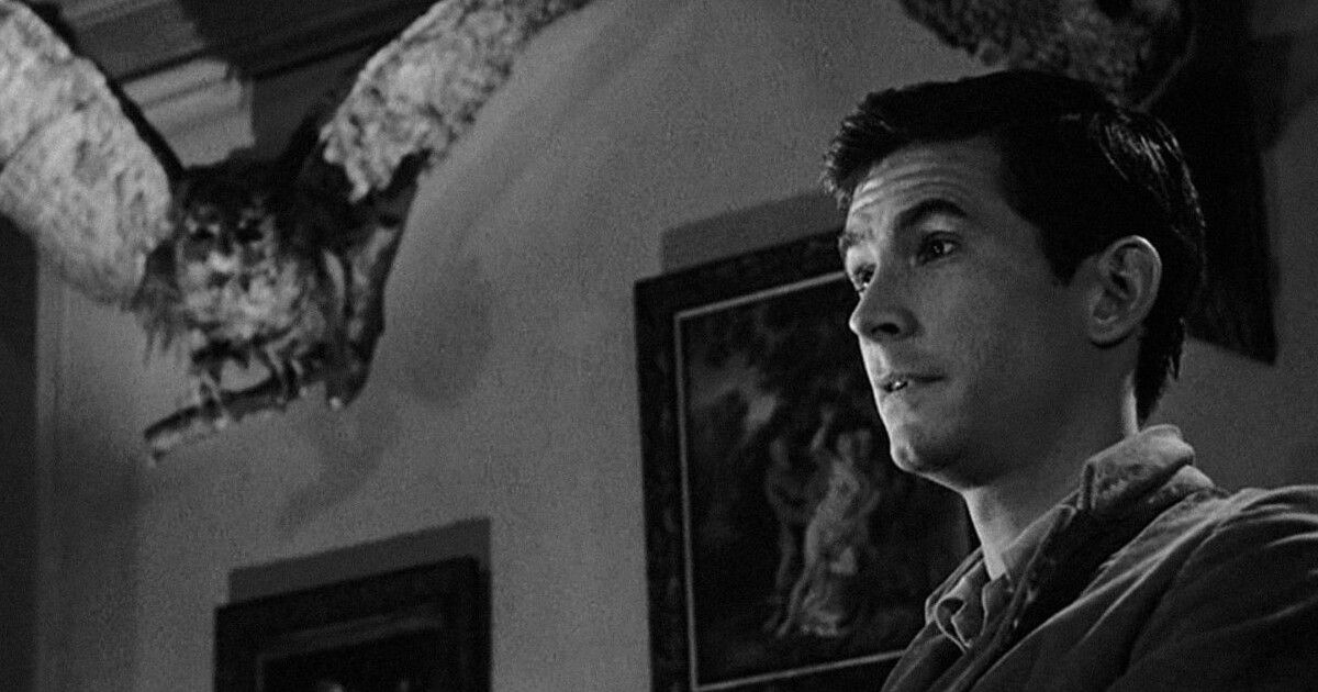 Anthony Perkins as Norman Bates surrounded by stuffed birds in Psycho