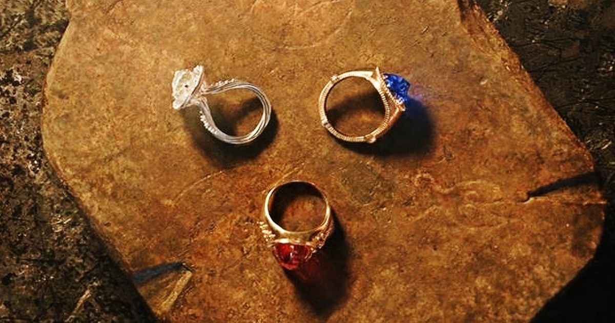 The three rings sitting on a table in Rings of Power