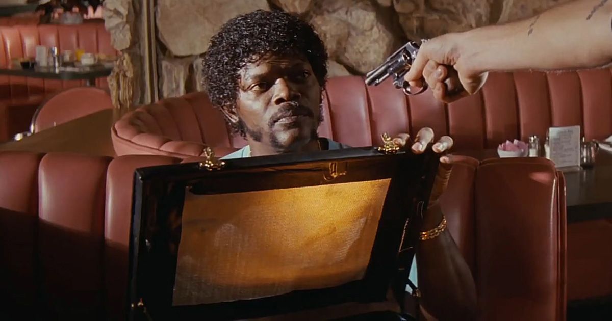 Samuel L Jackson opens a briefcase while being held at gunpoint in Pulp Fiction