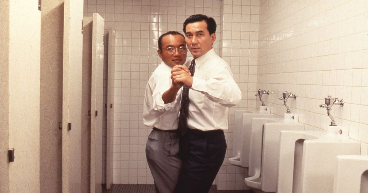 two men practice ballroom dancing in a bathroom in Shall We Dance?
