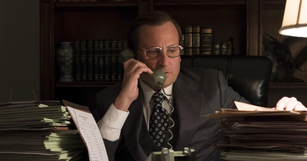 Steve Carell as Donald Rumsfeld in Vice sitting behind desk and on the phone