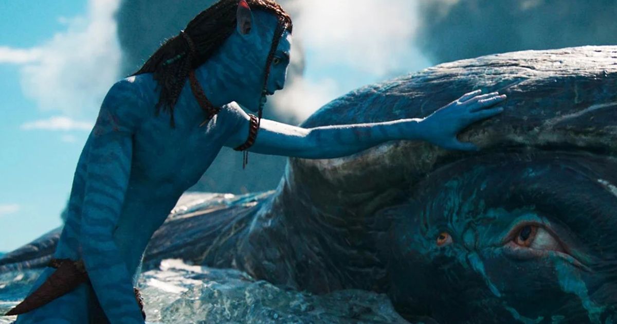 A Na'vi from Avatar comforting a sea creature