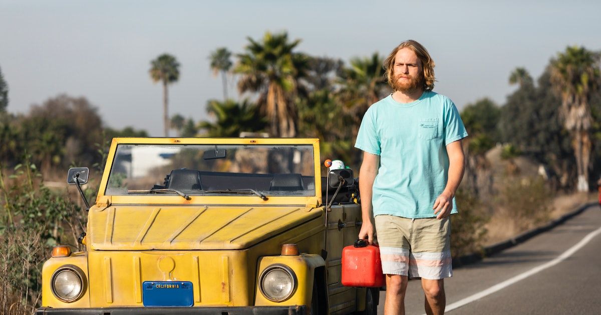 Wyatt Russell as Dud walks to get gas for his car
