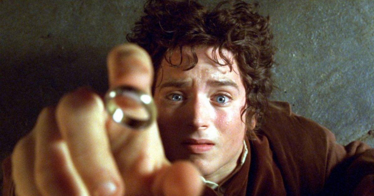 Elijah Wood as Frodo holding the ring