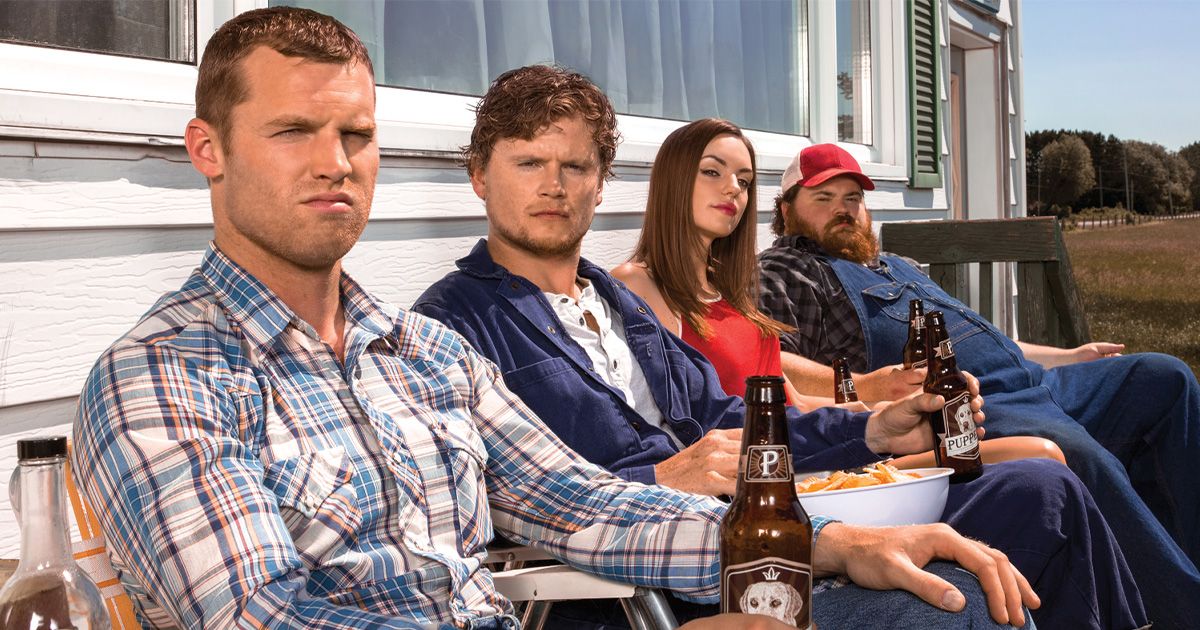 Letterkenny crew sits on Wayne's porch all looking towards the camera. 