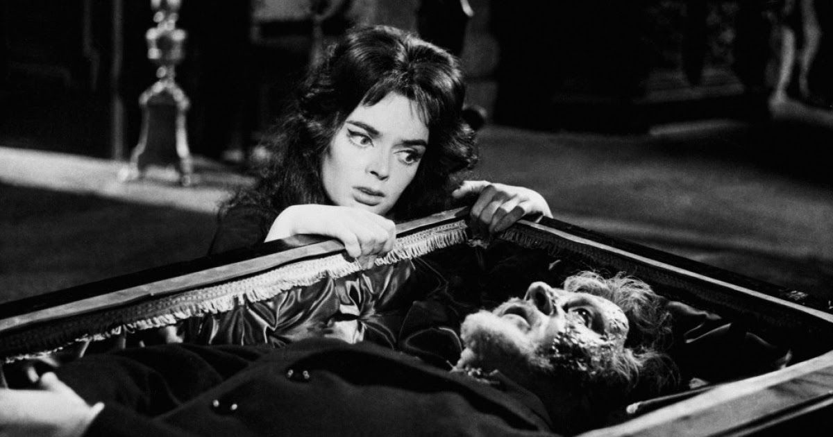 Barbara Steele looks at a body in a coffin in Black Sunday