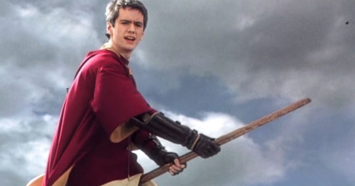 Oliver Wood poses on his Quidditch broom. 