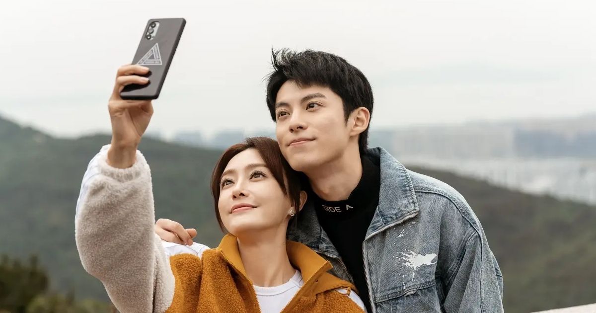 Man and woman take selfie together