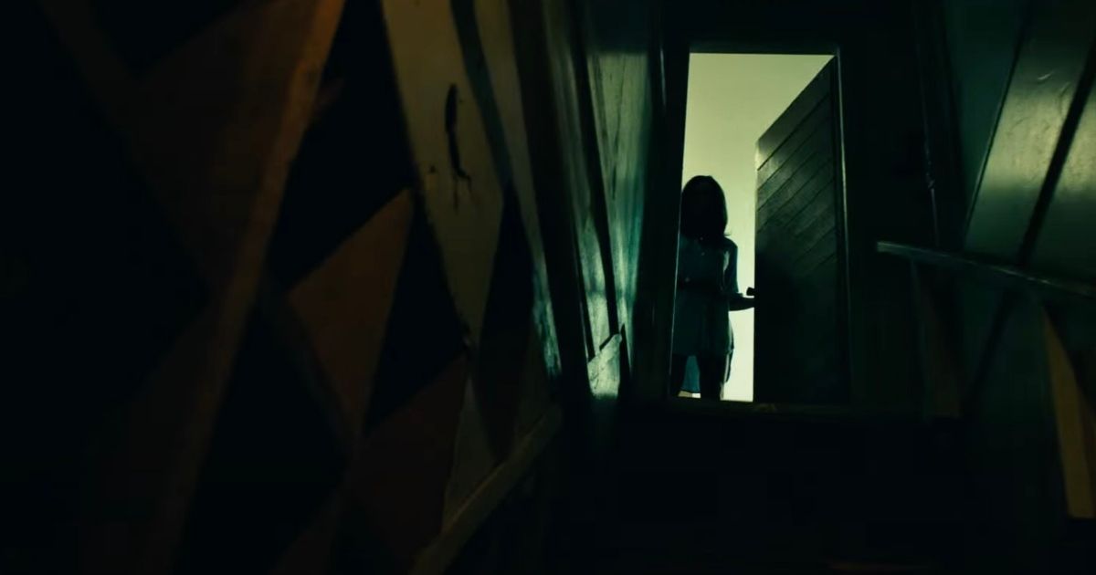Woman in the stairway in 2023 horror film Fear