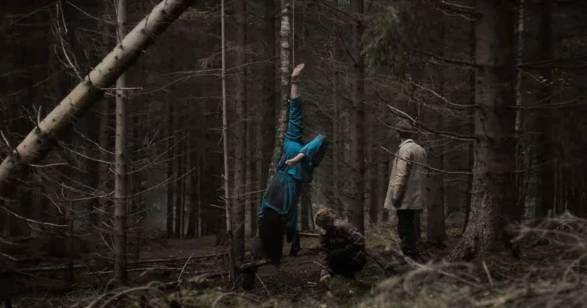 A body hangs upside down in the woods in The Chestnut Man