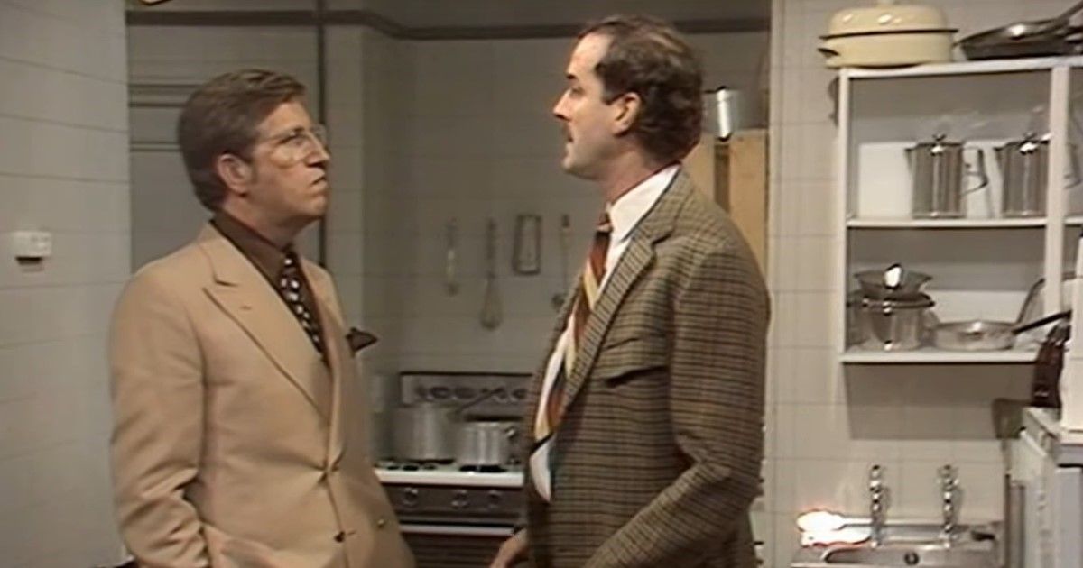 A man stares angrily at Basil in Fawlty Towers