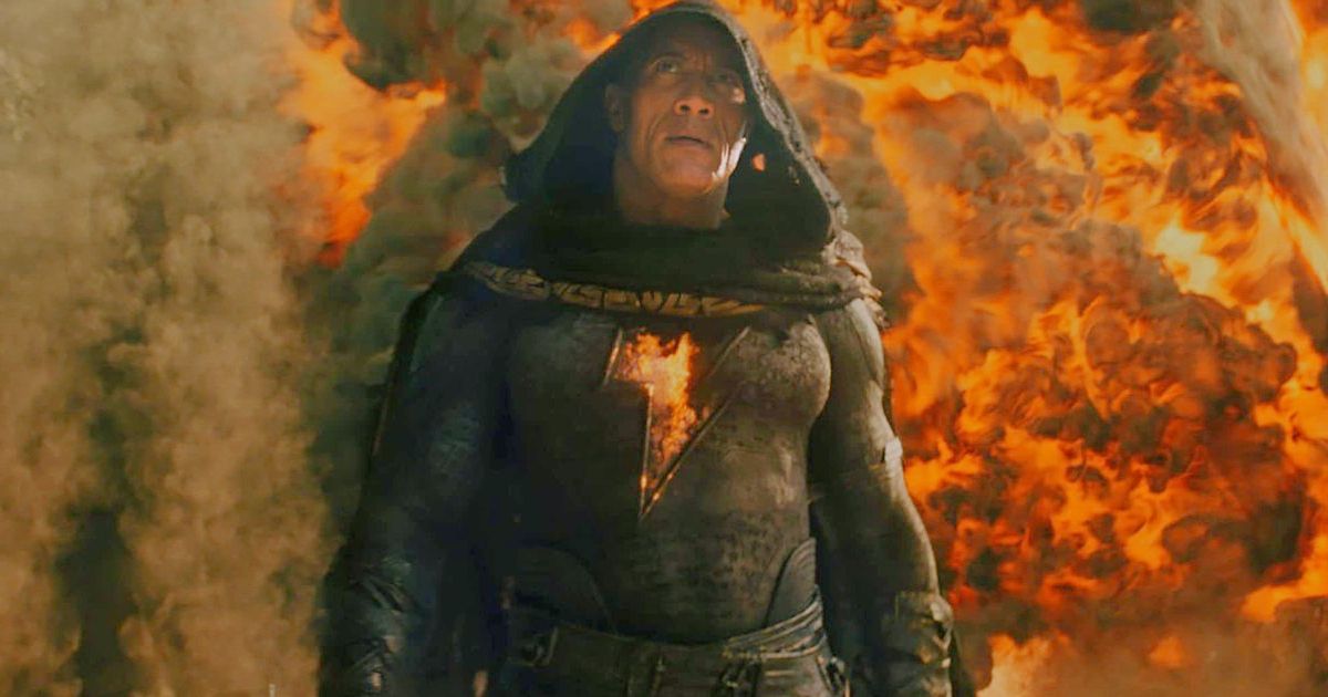 Black Adam walking in front of a wall of explosions, from the movie Black Adam.