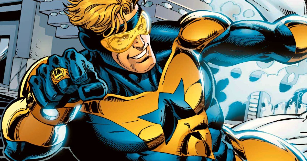 Booster Gold slides and points his ring from the DC Official Site.