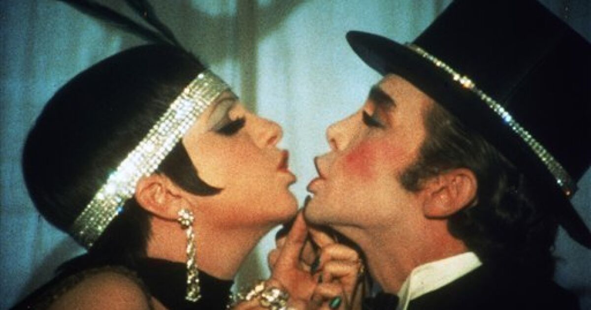 Liza Minelli and Joel Grey nearly share a kiss in Cabaret.