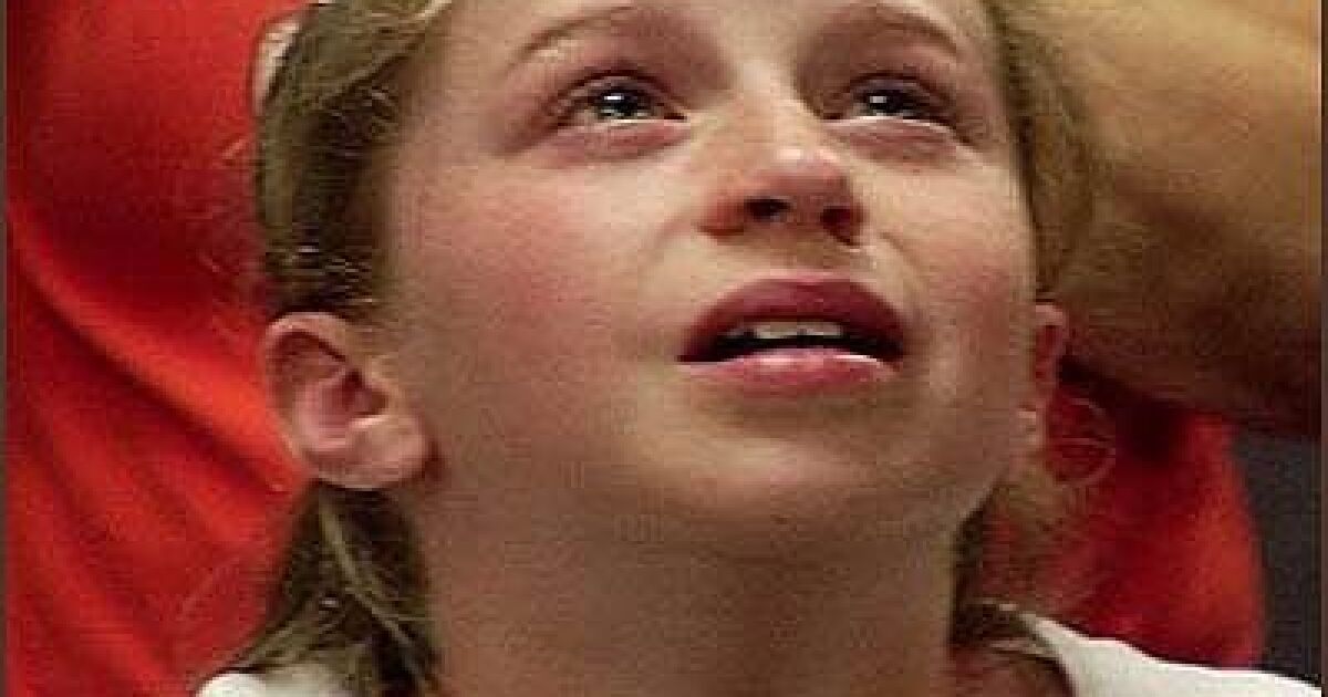 A young girl looks up at Camp Jesus