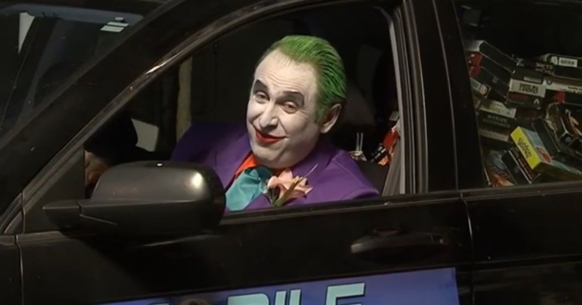 Gregg Turkington as Joker in a car of VHS tapes in On Cinema