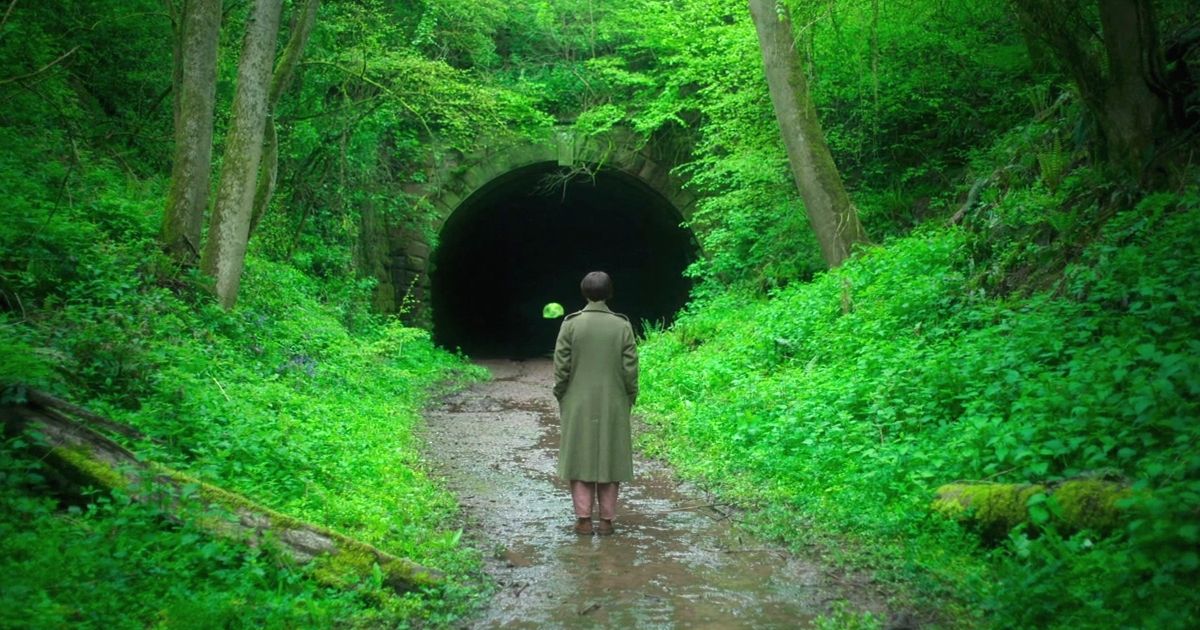 Harper Marlowe standing in front of an empty tunnel