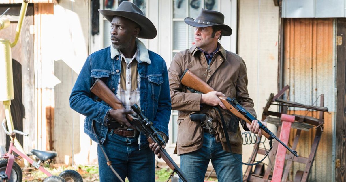 James Purefoy and Michael Kenneth Williams holding rifles in Hap and Leonard