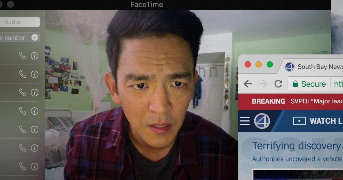 John Cho as David Kim on a facetime call, with a news article pulled up on screen