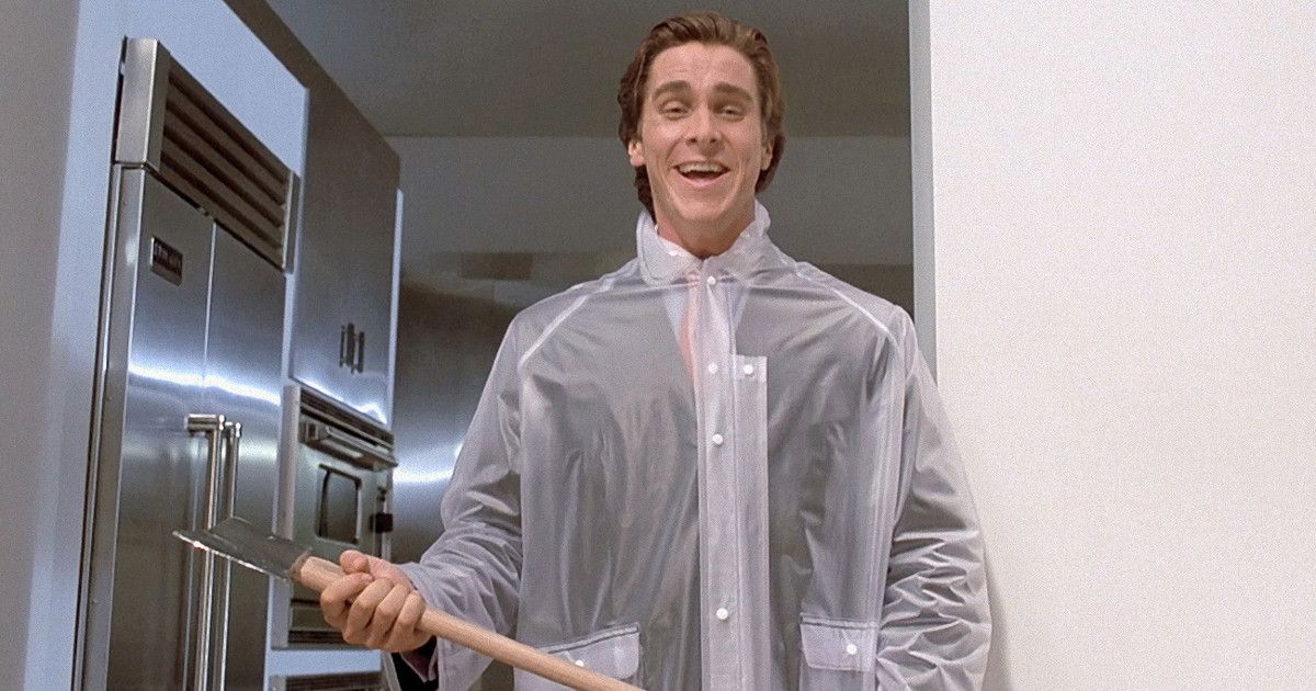 Christian Bale as Patrick Bateman holding an axe in American Psycho (2000)