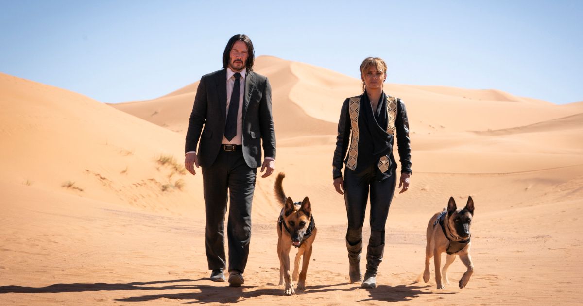 John Wick in the desert with dogs.