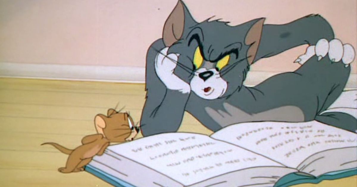 Tom and Jerry in Mouse Trouble reading a book