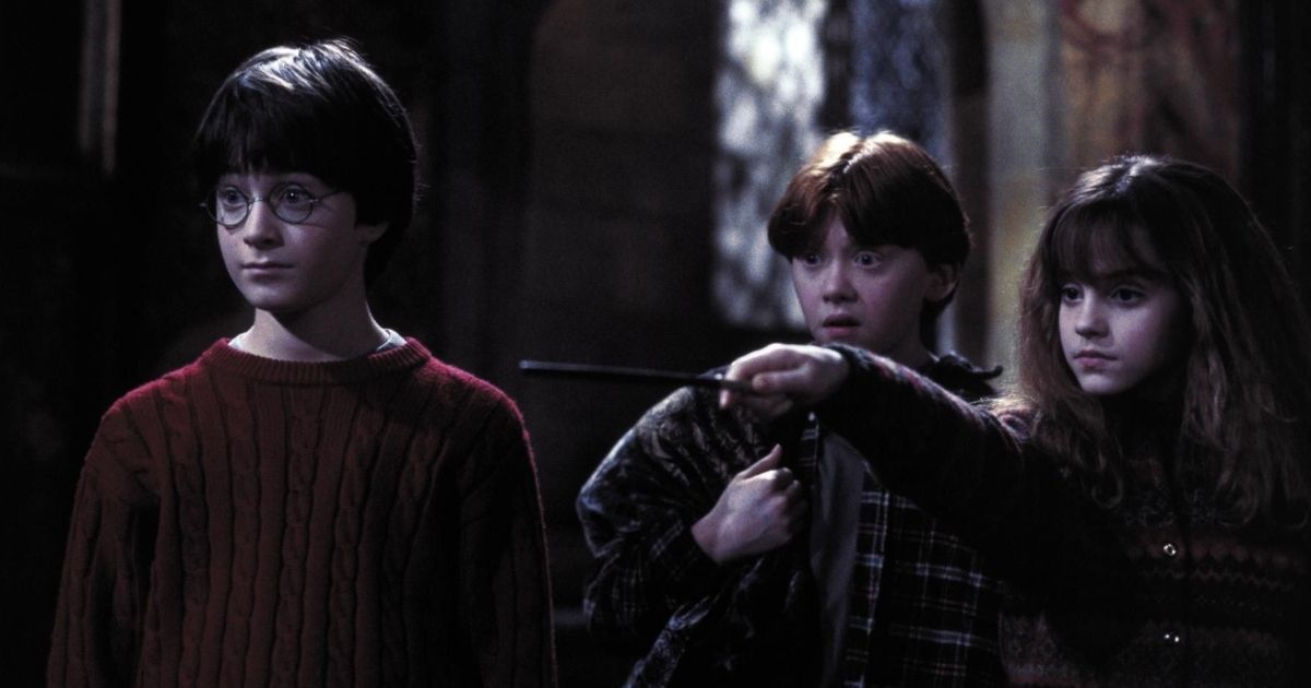 Harry Potter, Ron Weasley e Hermione Granger em Harry Potter e a Pedra Filosofal