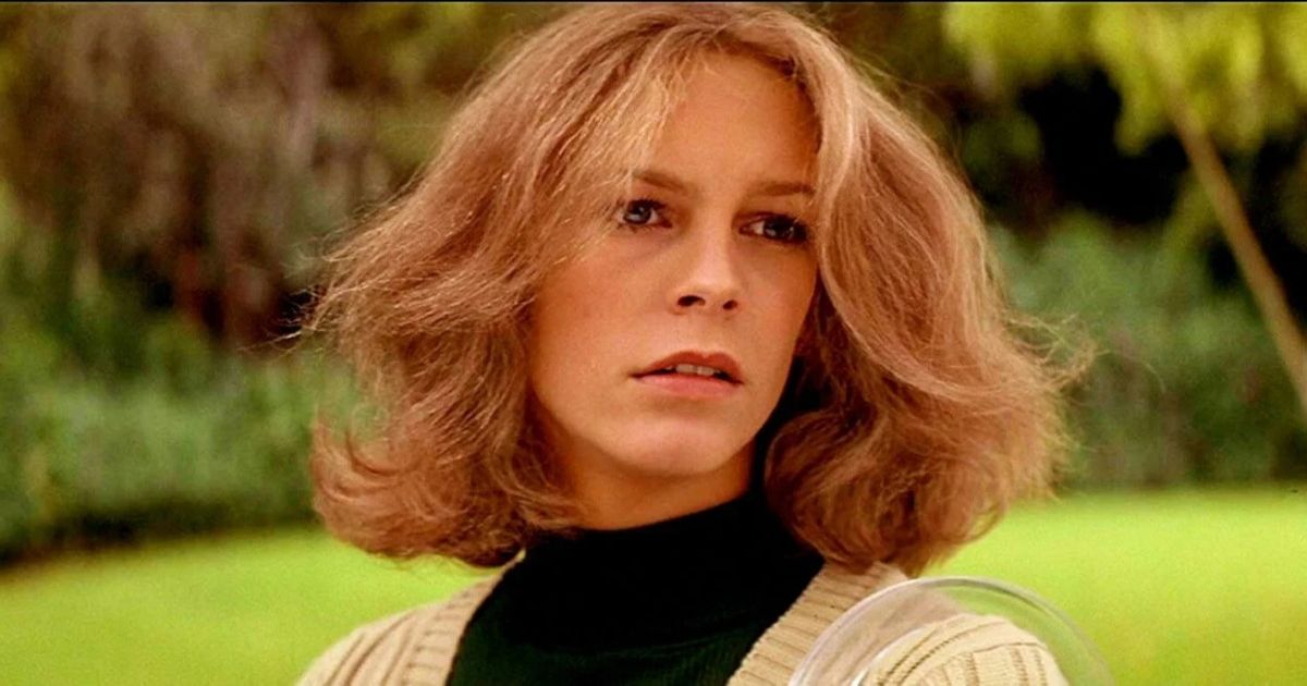 Jamie Lee Curtis as Laurie Strode wearing a black turtle neck and tan sweater in Halloween.