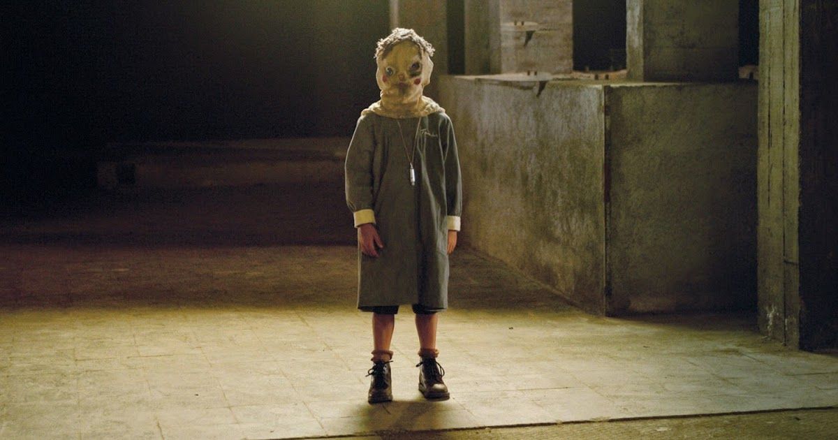 A child wearing a mask in The Orphanage