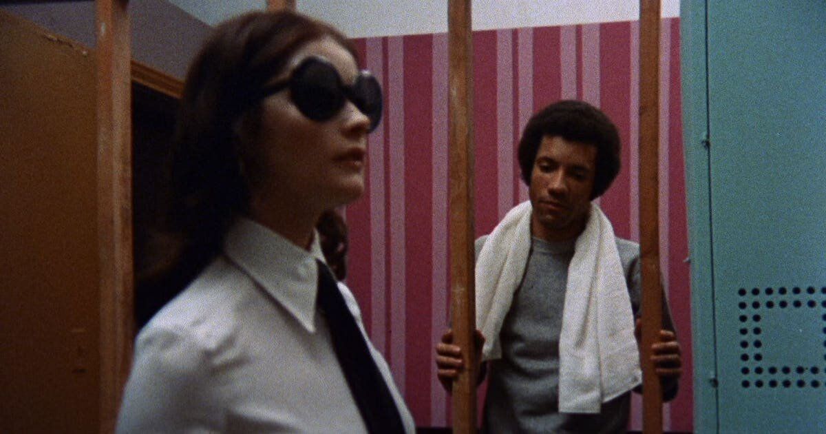 A woman in sunglasses and a man in a towel in Sisters