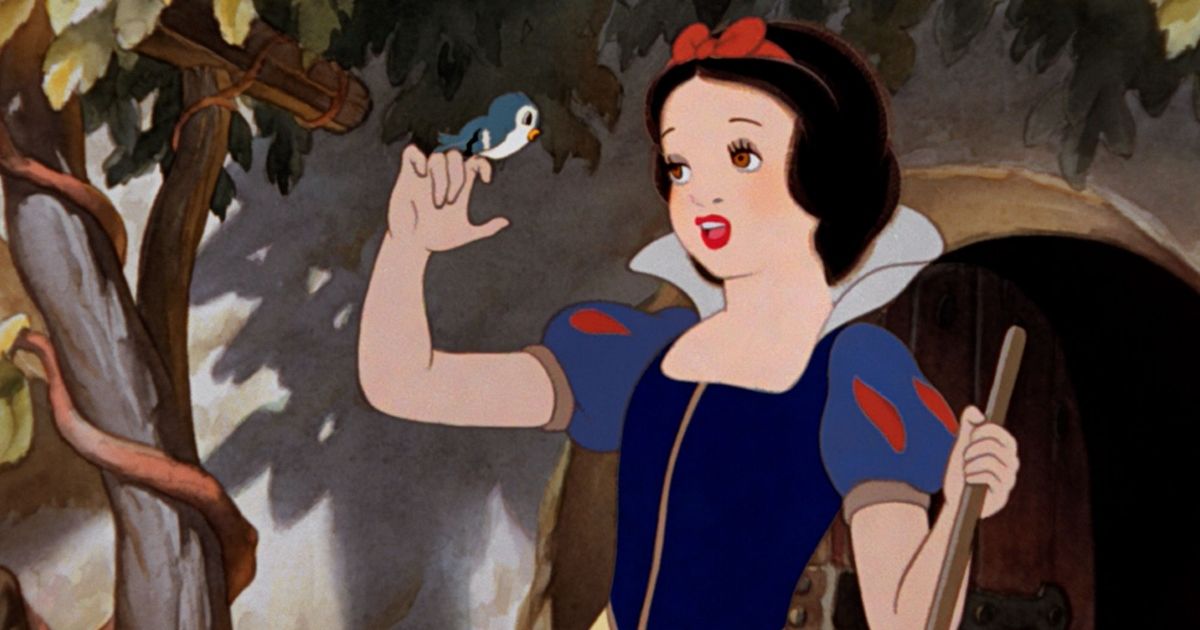 Snow White sings as she does the chores