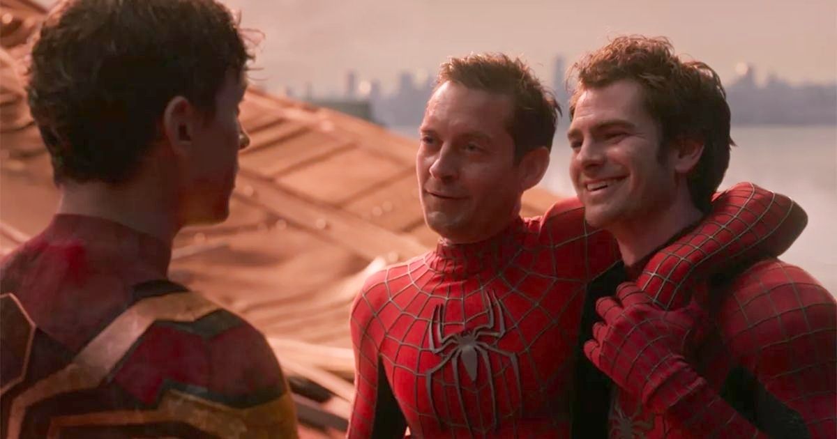 Spider-Man: No Way Home Tom Holland as Peter Parker 1, Tobery Maguire as Peter Parker 2, and Andrew Garfield as Peter Parker 3, standing near the Statue of Liberty in New York City at the end of Spider-Man: No Way Home.