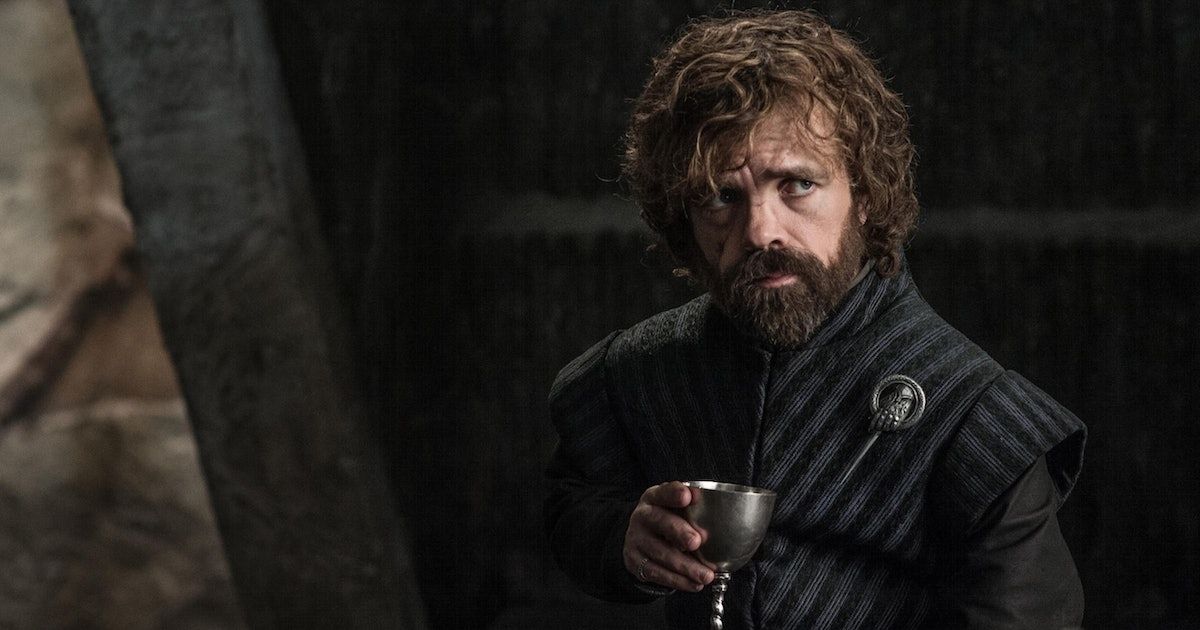 Game of Thrones cast: Tyrion holds a glass of wine. 