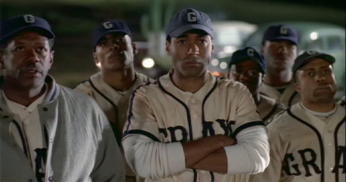 Jesse L. Martin with baseball teammates in The X-Files