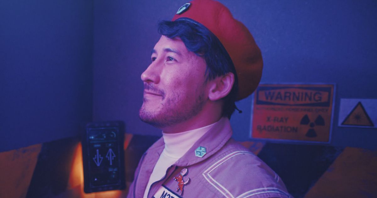 Markiplier with a uniform on with a sign for X-Ray radiation behind him in In Space.