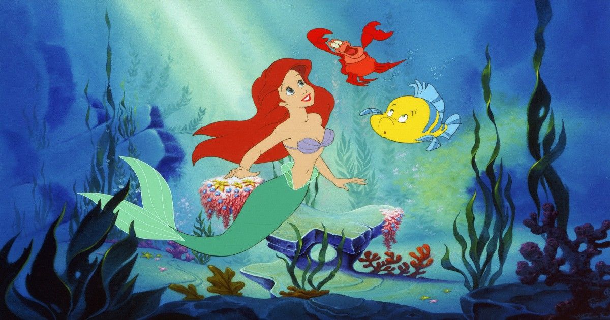 The Little Mermaid and her friends Sebastian and Flounder singing.