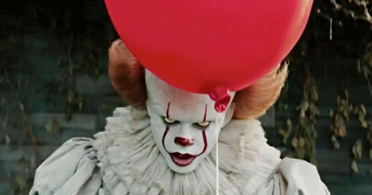 Pennywise holding a red balloon from 2017's It adaptation