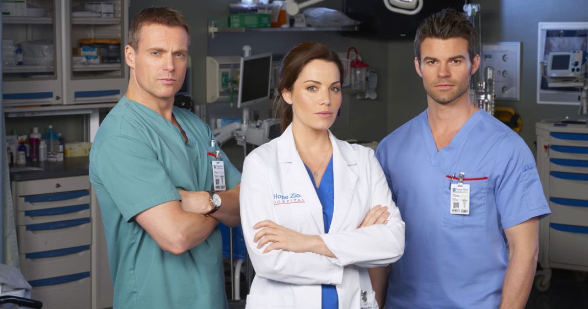 Daniel Gillies, Michael Shanks, and Erica Durance in Saving Hope (2012)