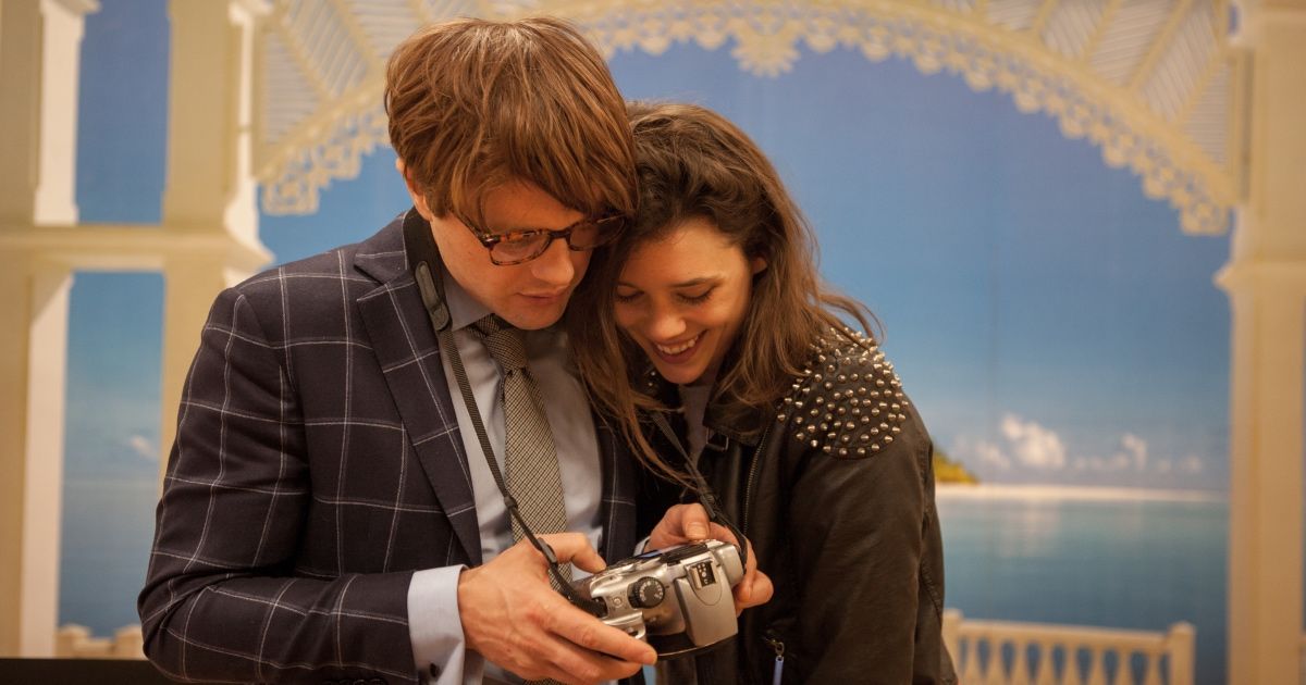 Michael Pitt and Astrid Bergès-Frisbey share a camera in I Origins (2014).