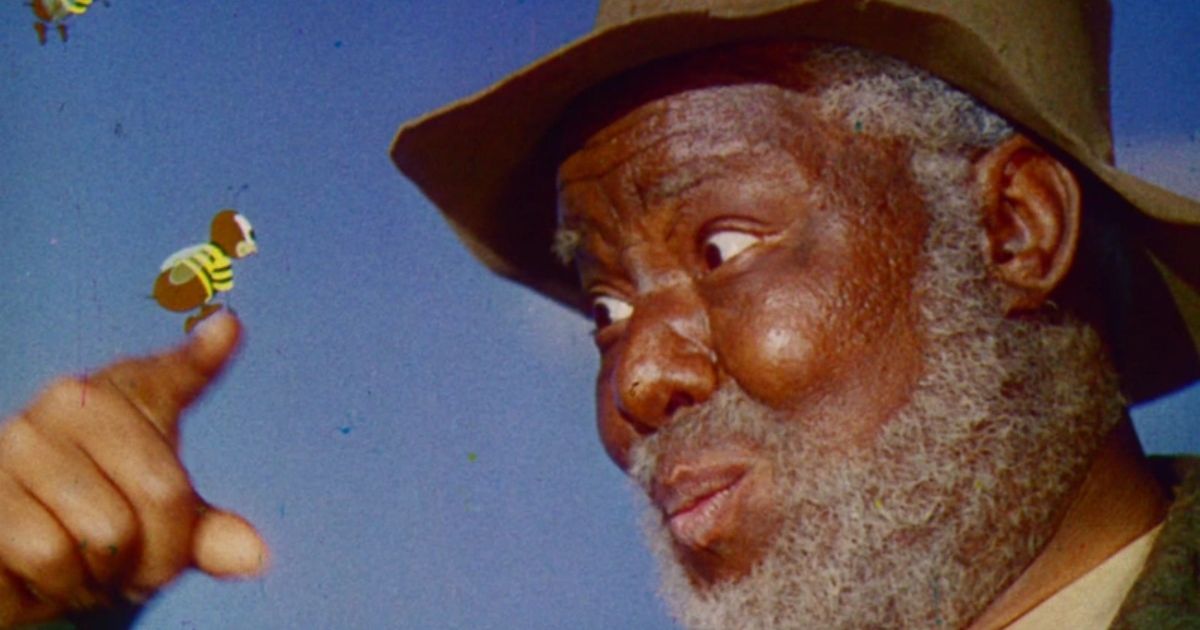 James Baskett as Uncle Remus with an animated bee in Song of the South