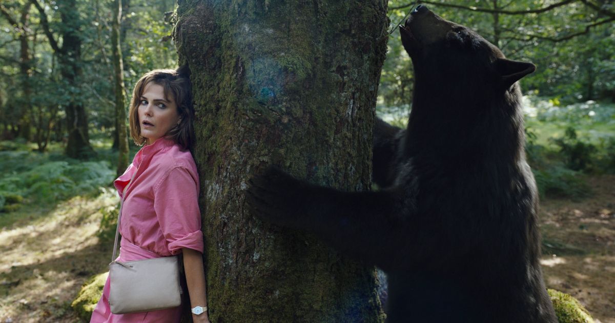 Keri Russell in Cocaine Bear tree climb