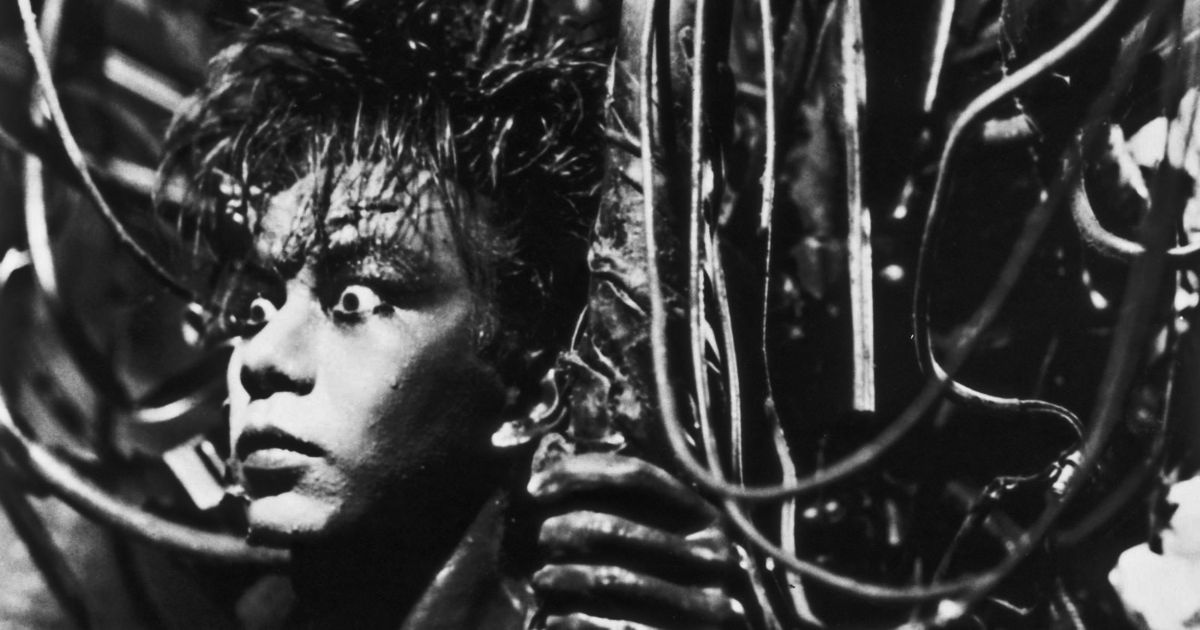 A man stands amid wires and metal in Tetsuo: The Iron Man