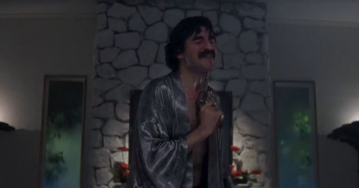 Alfred Molina with a gun in drug deal scene of Boogie Nights