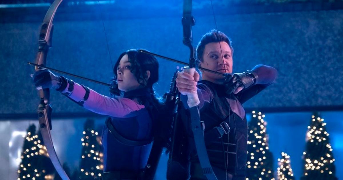 Hailee Steinfeld as Kate Bishop and Jeremy Renner as Hawkeye with drawn bows