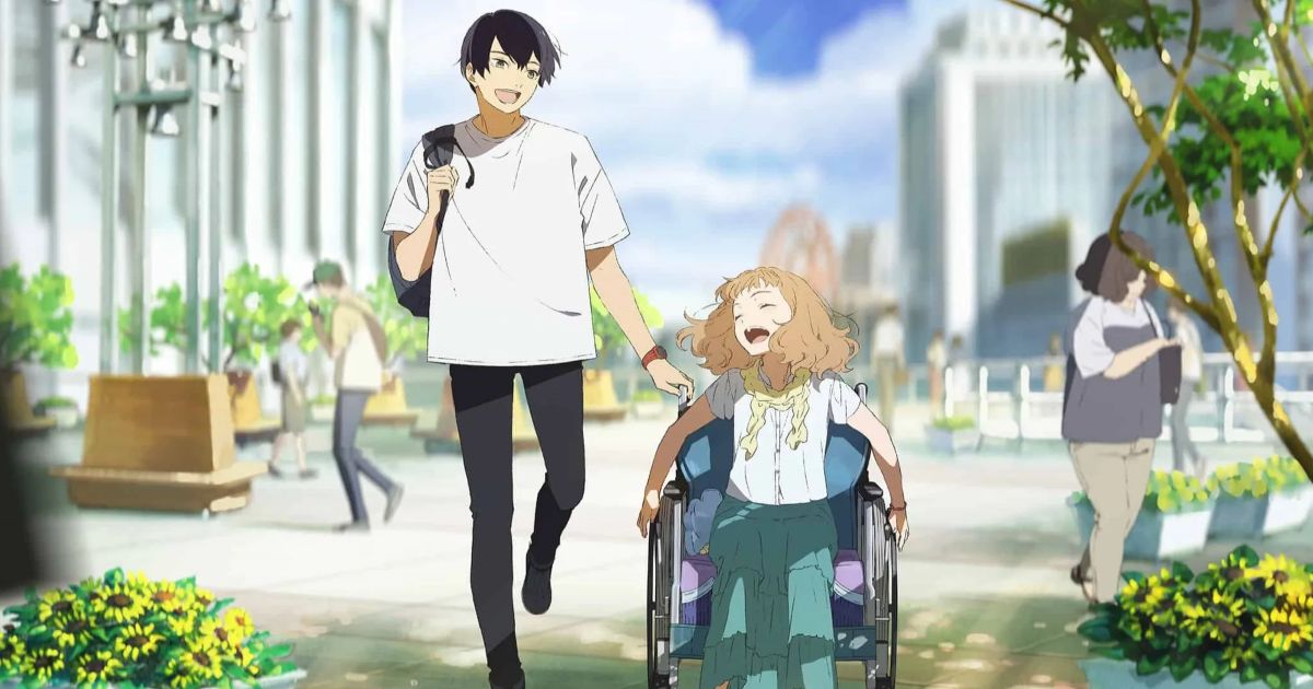 A Japanese animated frame of a man and a woman, the man wearing a white tee shirt and black jeans while the woman has a white shirt and long green pants. The woman is in a wheelchair and both are smiling at each other in front of a beautiful backshot of the city