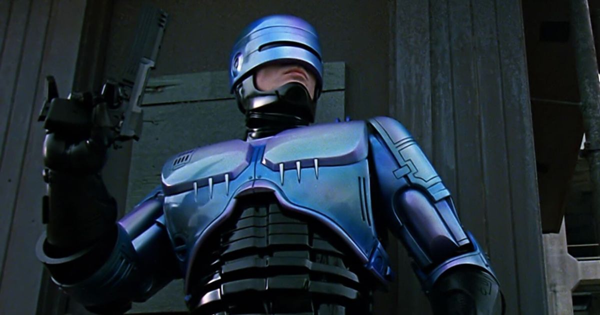 Peter Weller holding a gun in RoboCop (1987)