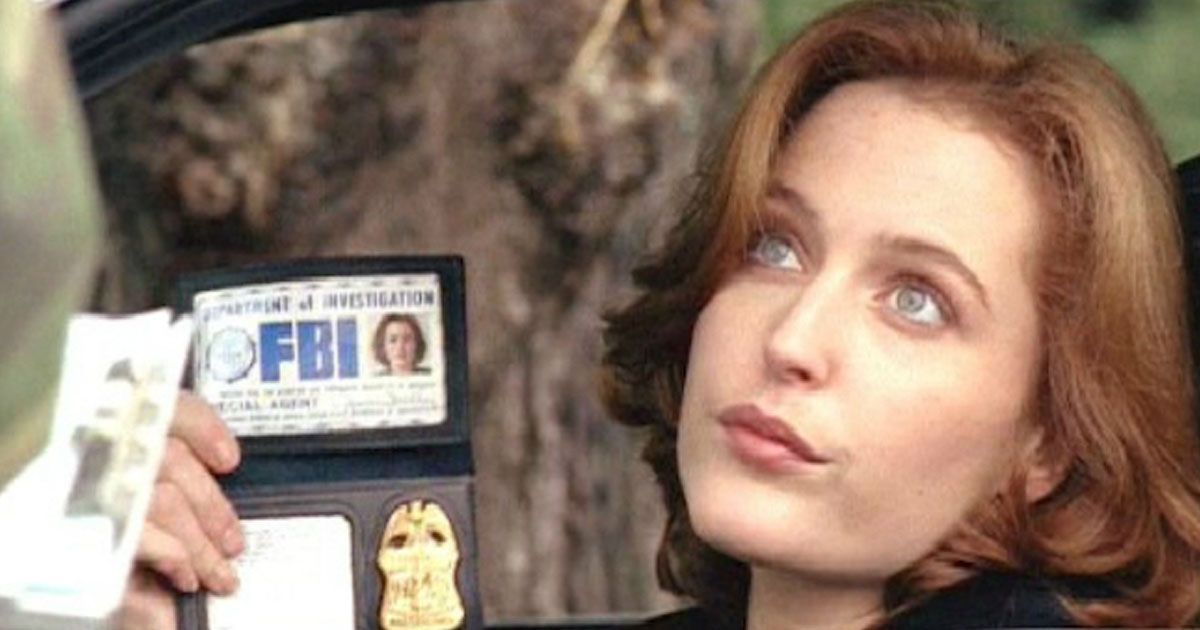 Agent Dana Scully flashing her badge